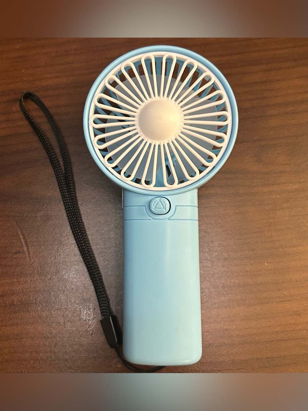 Light blue mini handheld fan w/ wrist strap